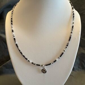 Hand beaded necklace with Yin Yang pendant.